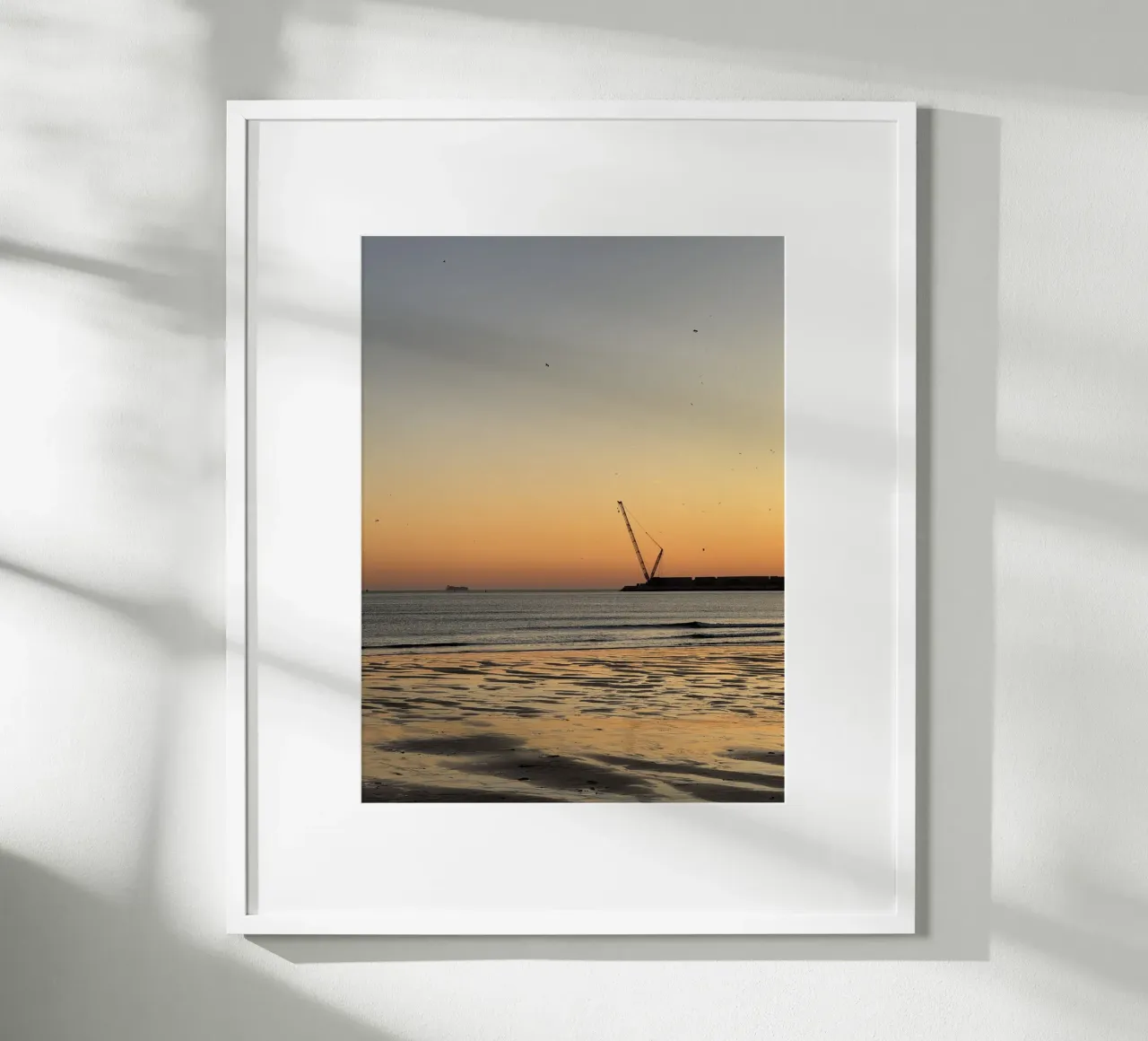 Birds in Flight and Distant Crane during sunset at Praia de hahnemühle by byrieneke