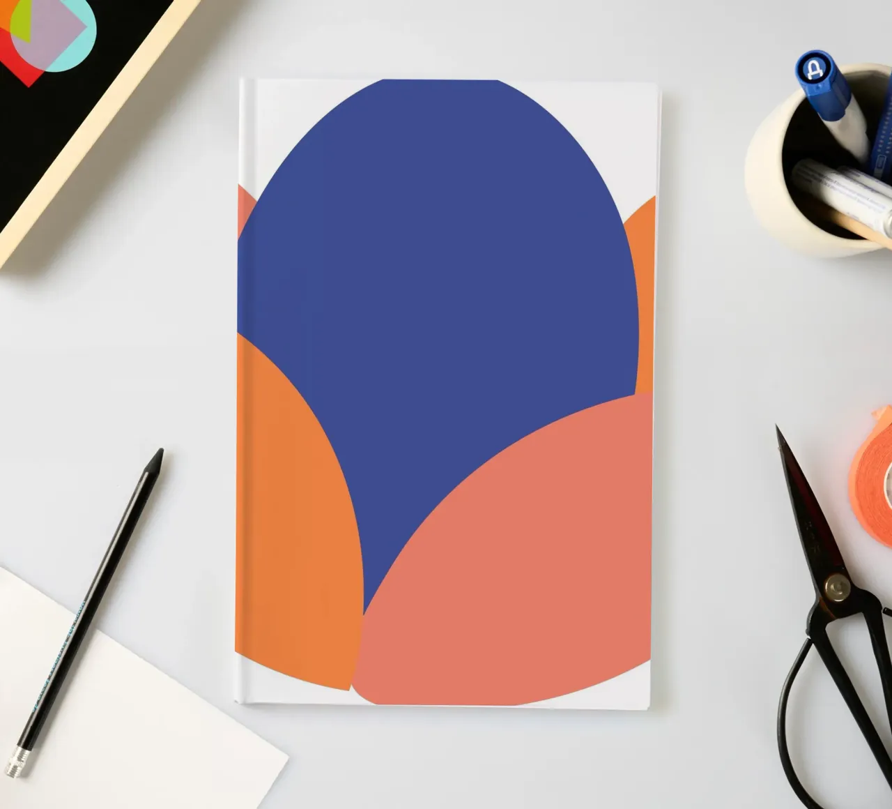 oval shape simplified notebook by pastel color shape