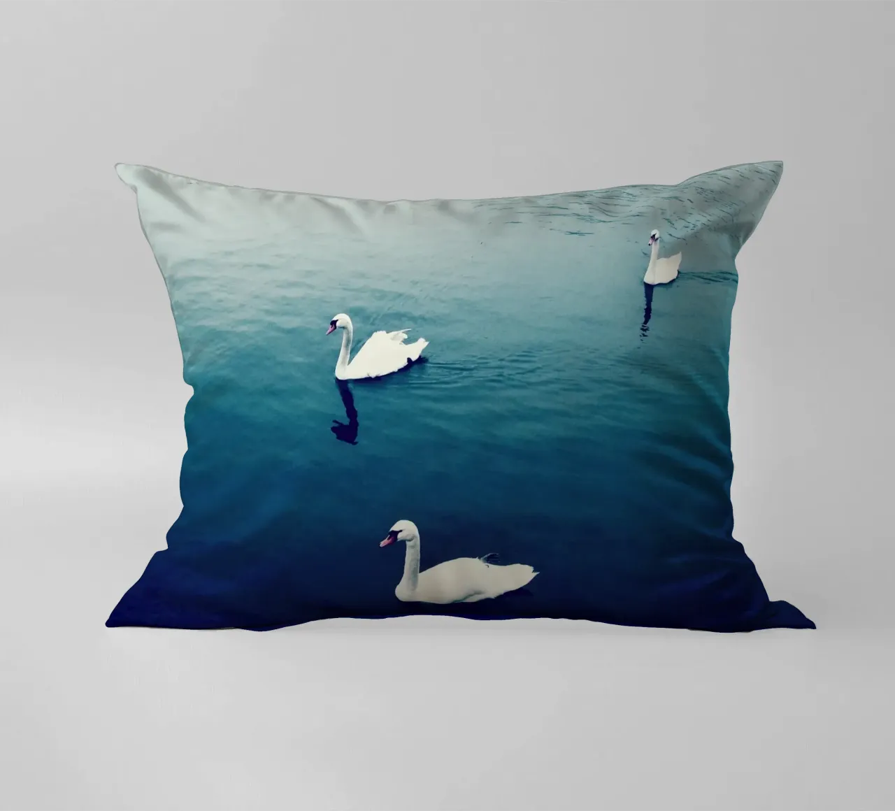 Swan Family in the Lake decorative cushion by KISSA STUDIO