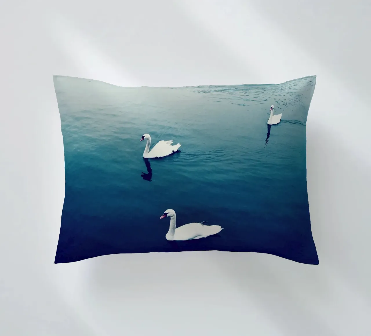 Swan Family in the Lake decorative cushion by KISSA STUDIO