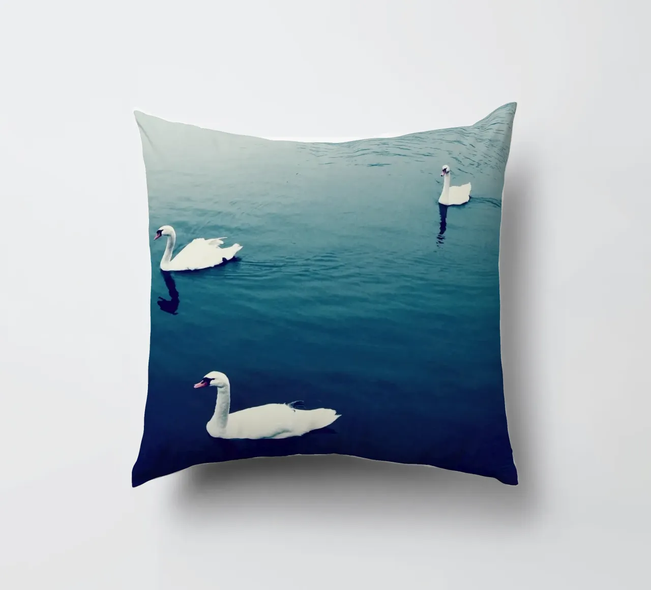 Swan Family in the Lake decorative cushion by KISSA STUDIO