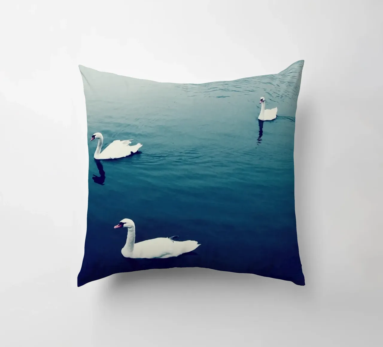 Swan Family in the Lake decorative cushion by KISSA STUDIO