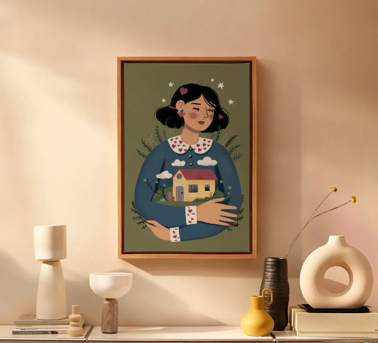 Holding a Tiny House canvas with Floater frame by Marigold Tiga