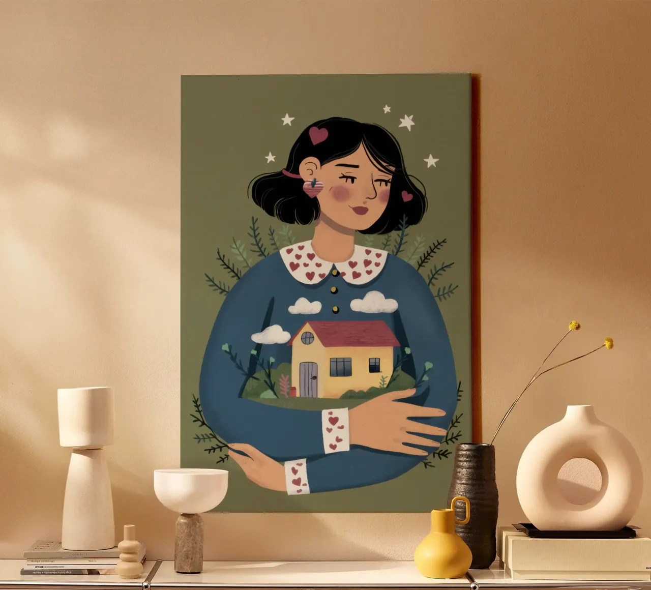 Holding a Tiny House canvas with Floater frame by Marigold Tiga