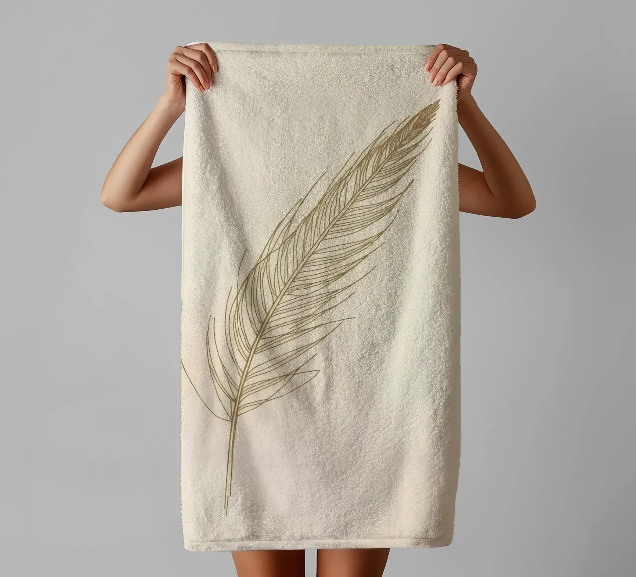 Single light brown feather sketch on a cream background towel by DesignDoodle