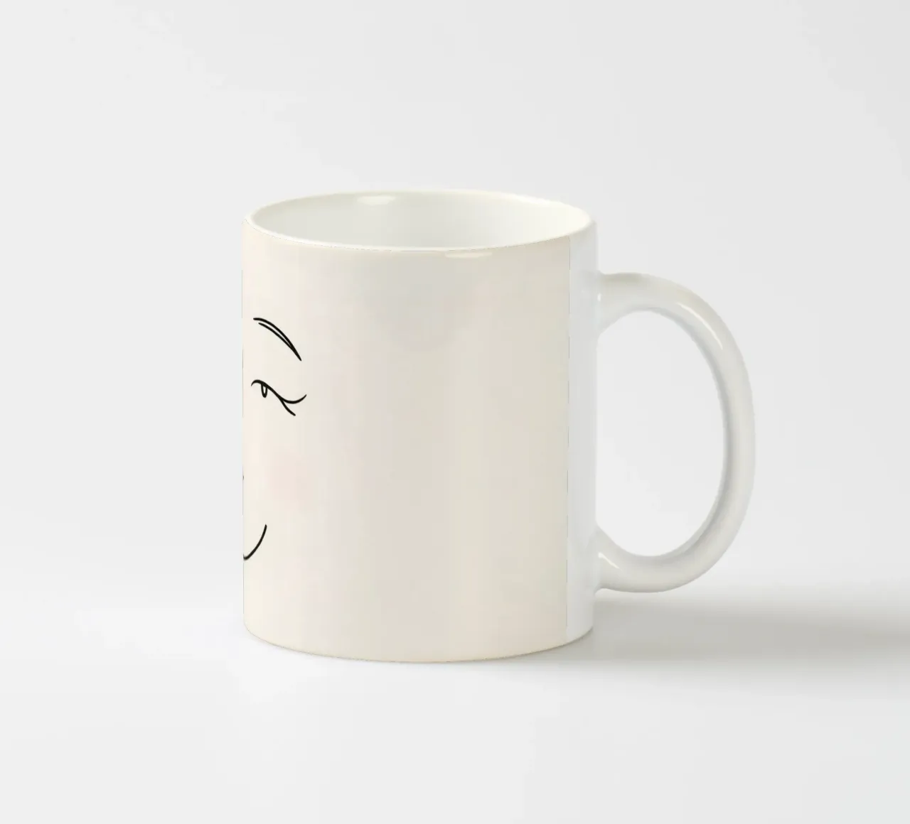 Simple line drawing shows a smiling face with blushed cheek ceramic mug by DesignDoodle
