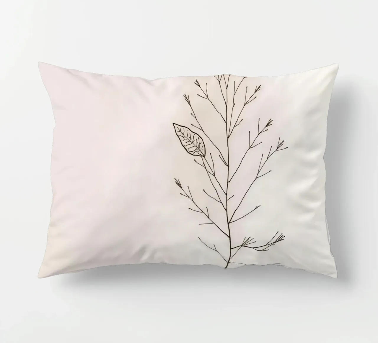 Single minimal botanical branch, displaying a leaf decorative cushion by DesignDoodle