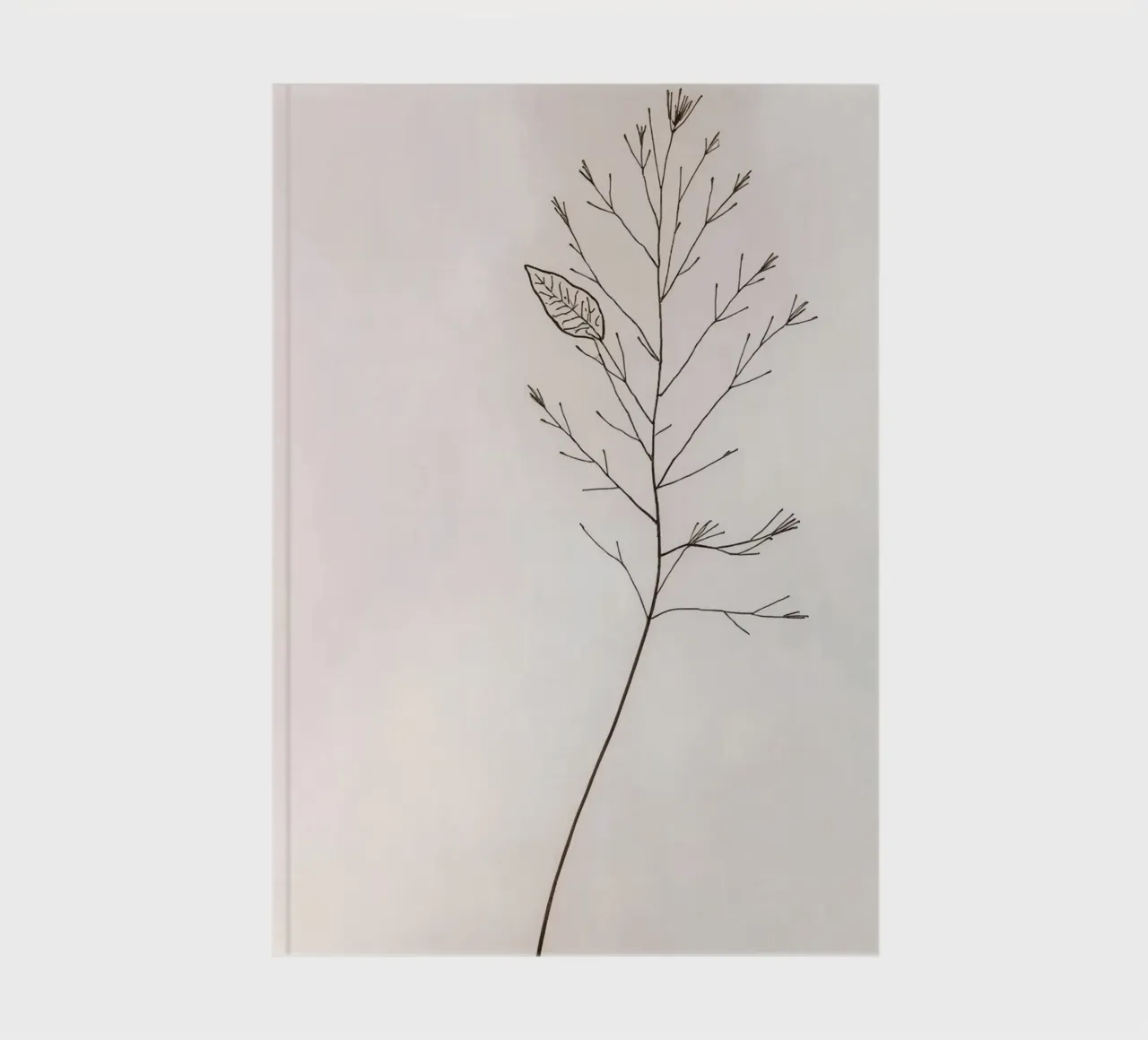 Single minimal botanical branch, displaying a leaf notebook by DesignDoodle