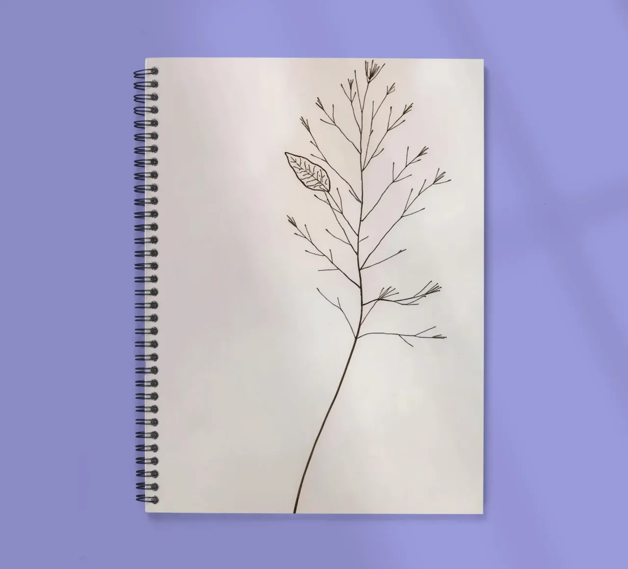 Single minimal botanical branch, displaying a leaf spiral notebook by DesignDoodle