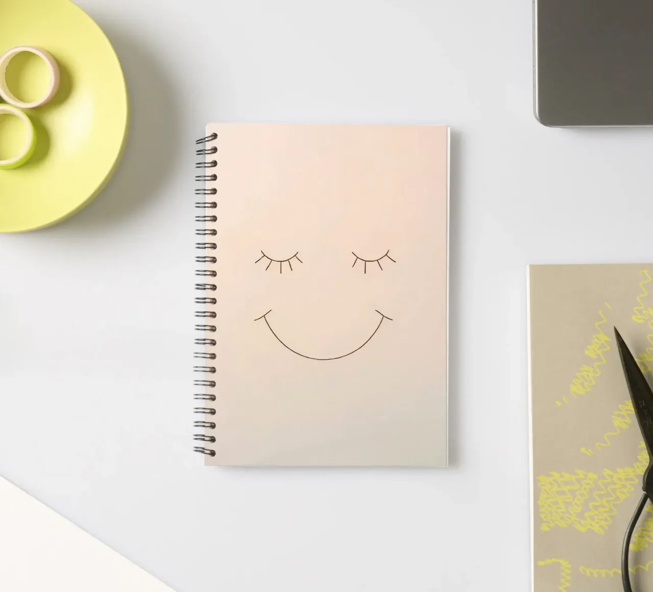 Simple drawing of a face with closed eyes and a smile spiral notebook by DesignDoodle