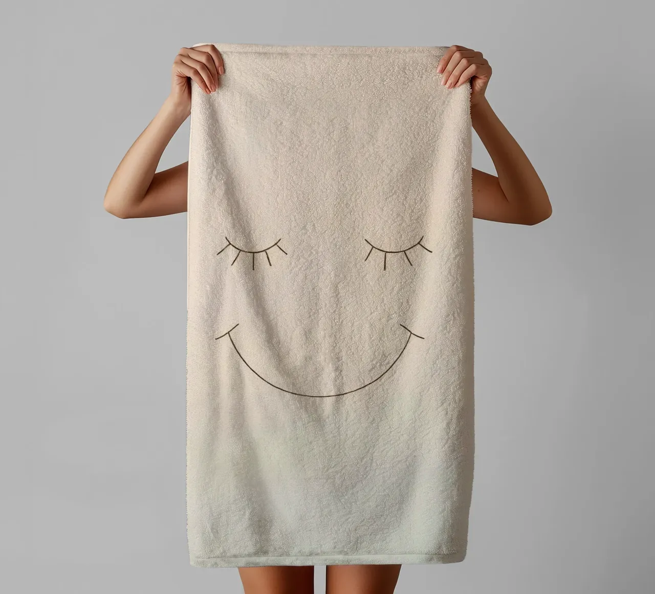 Simple drawing of a face with closed eyes and a smile towel by DesignDoodle