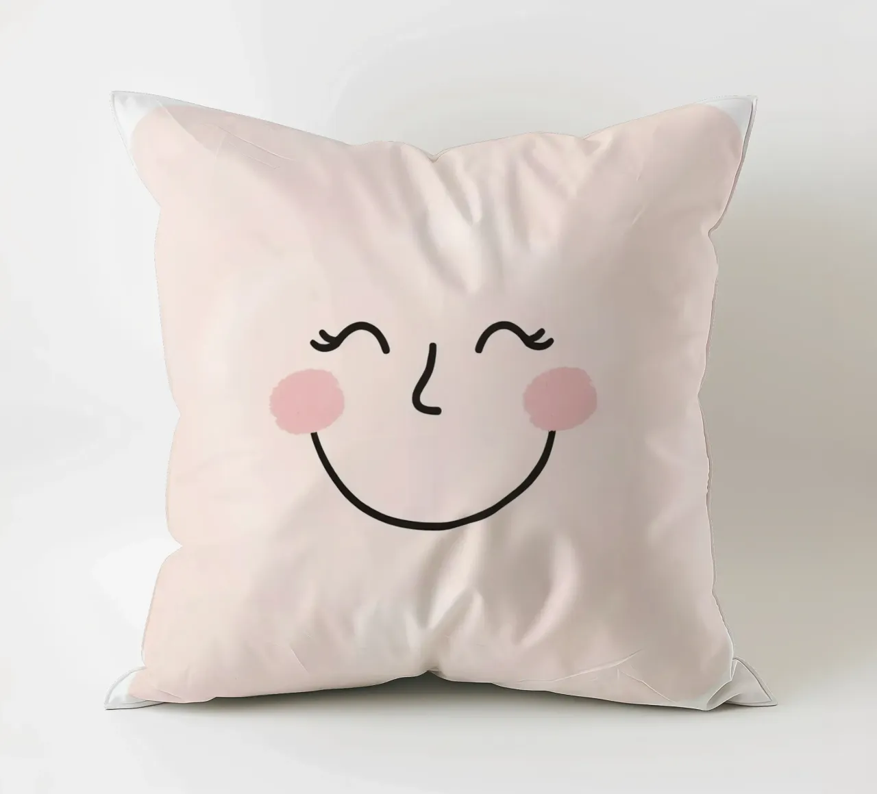 Disegno di una faccia felice su sfondo rosa chiaro cuscino da DesignDoodle