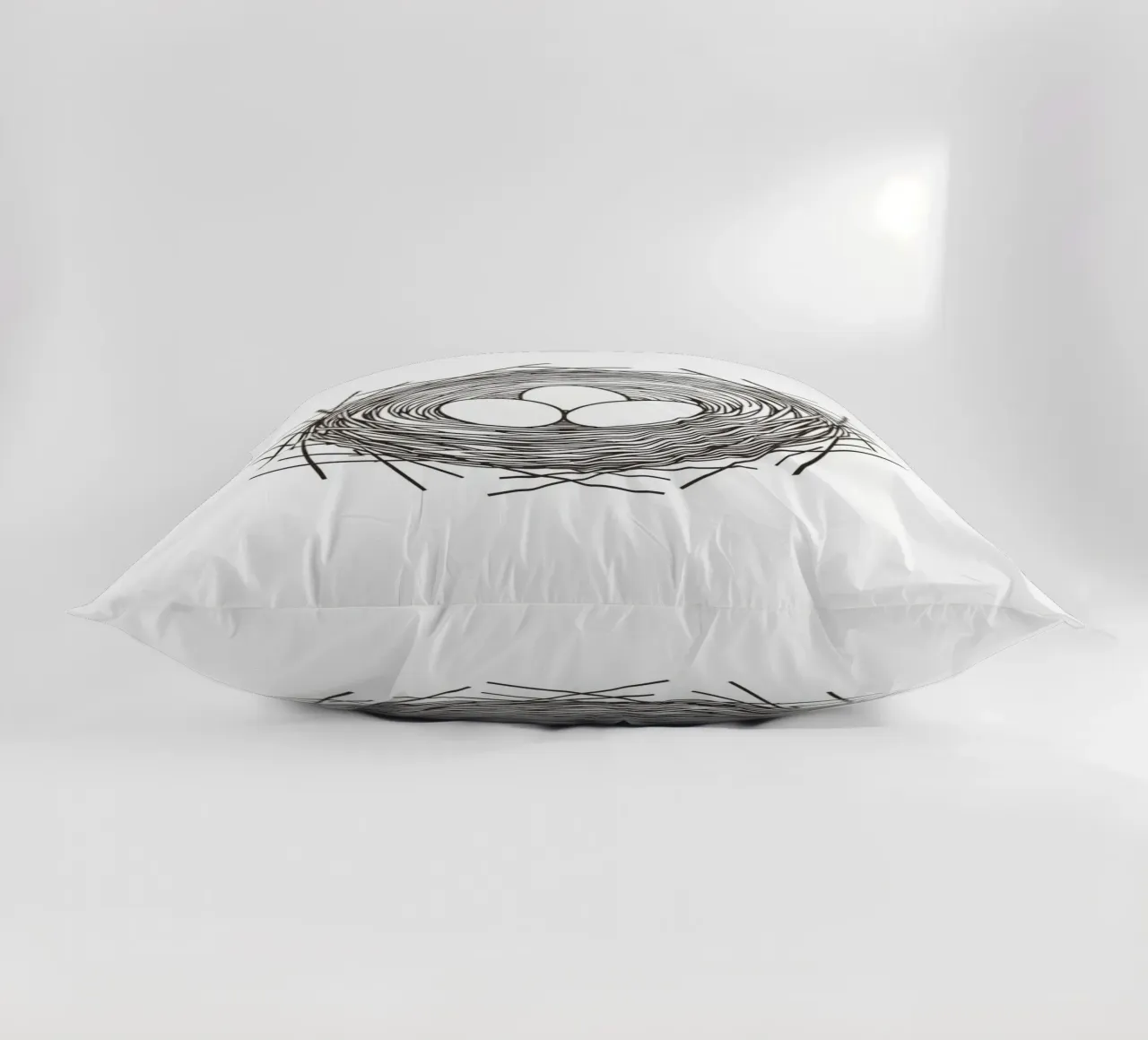 Nest containing three eggs depicted with line art decorative cushion by DesignDoodle