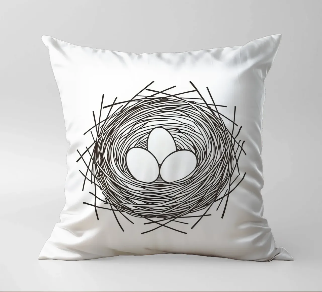 Nest containing three eggs depicted with line art decorative cushion by DesignDoodle
