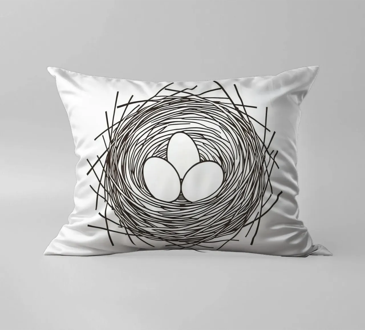 Nest containing three eggs depicted with line art decorative cushion by DesignDoodle