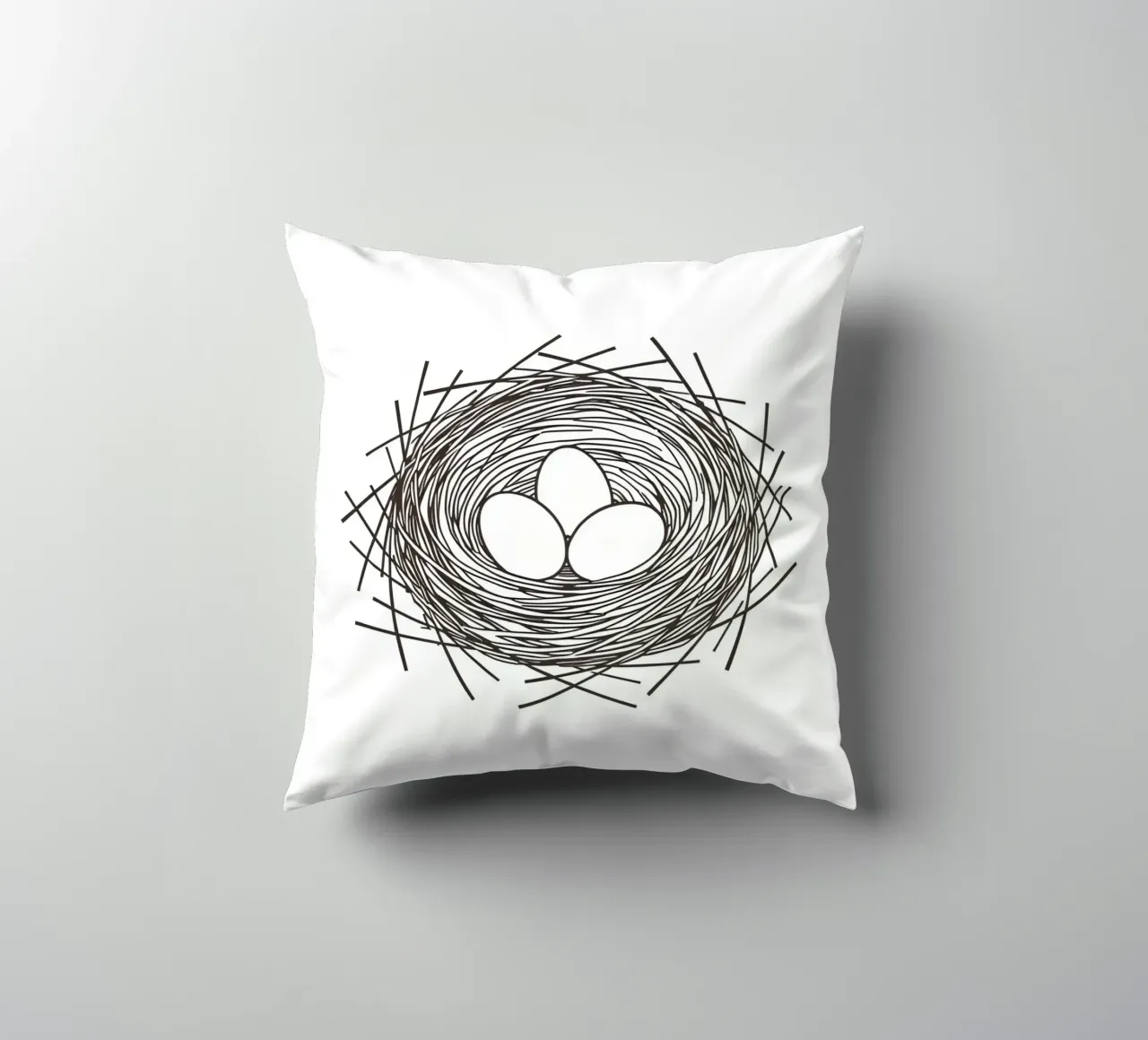 Nest containing three eggs depicted with line art decorative cushion by DesignDoodle