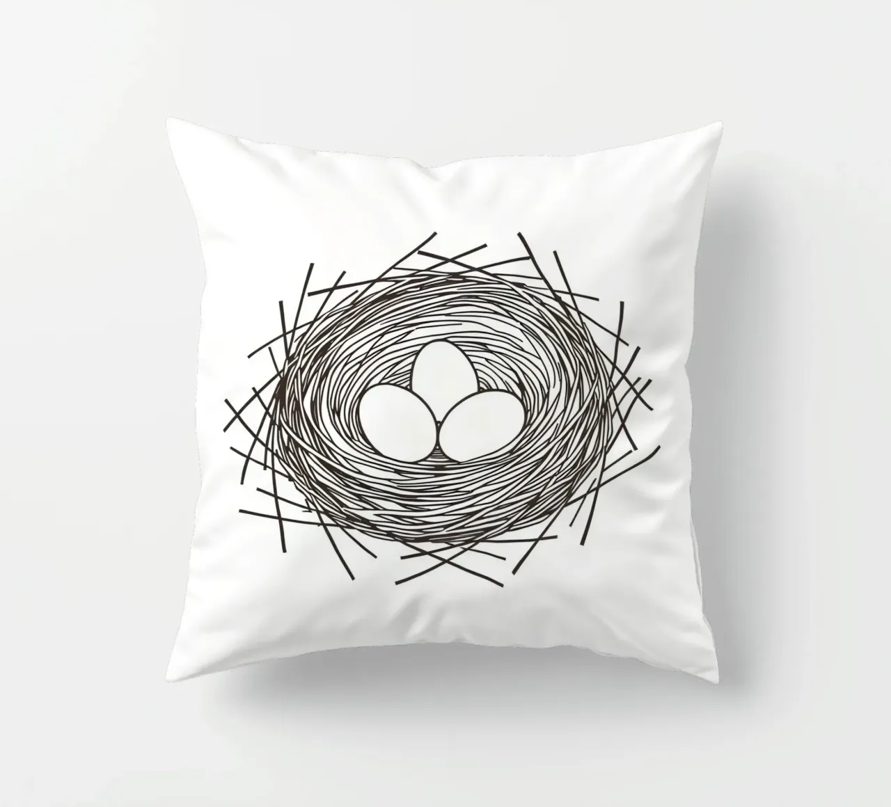 Nest containing three eggs depicted with line art decorative cushion by DesignDoodle
