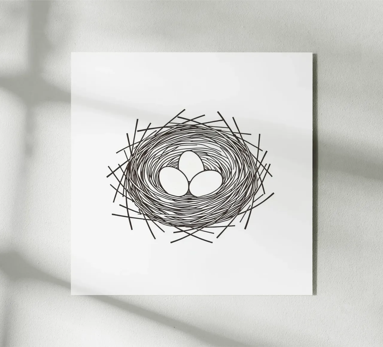 Nid contenant trois œufs représentés par un dessin au trait plexiglas de DesignDoodle