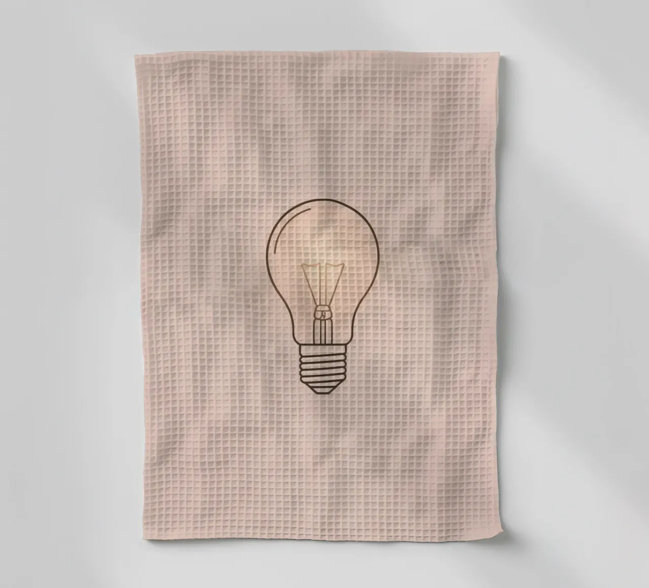 Illustration d'une ampoule à incandescence rétro qui brille doucement torchon de DesignDoodle