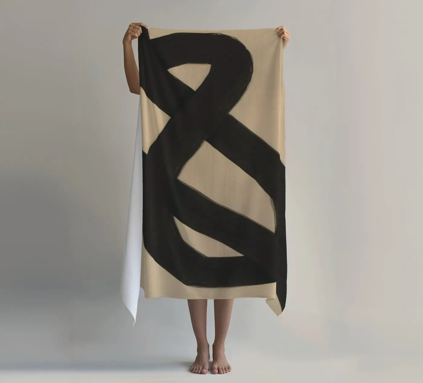 Interlocking black beach towel by Little Dean