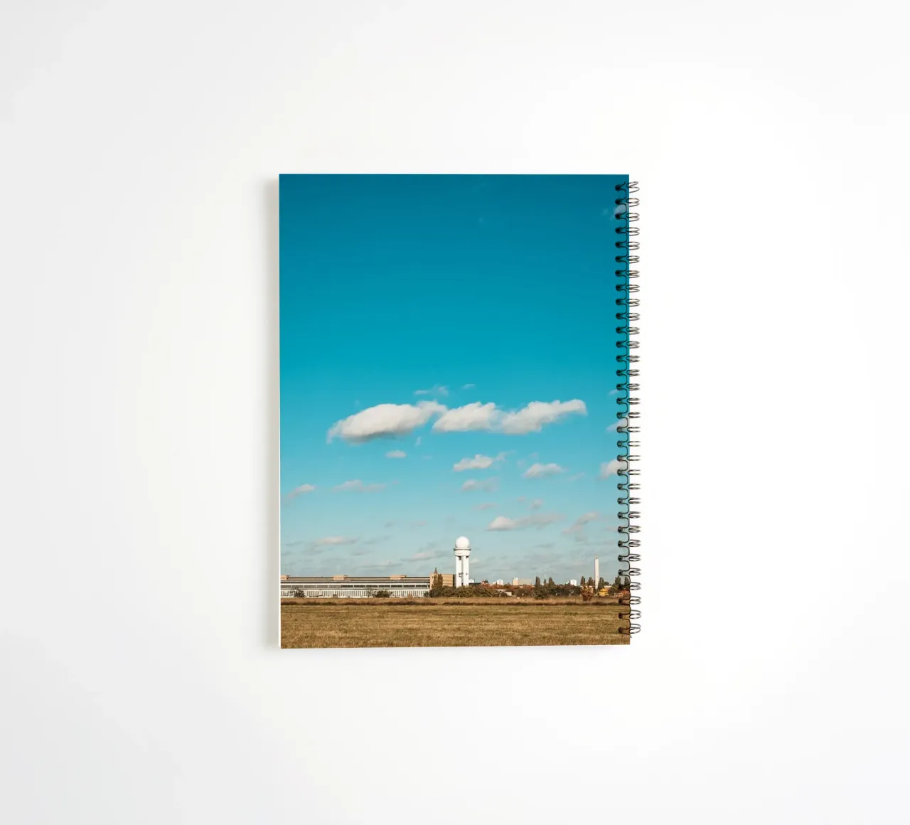 Tempelhofer Feld in Berlin with television tower in the background spiral notebook by Bold and Retro