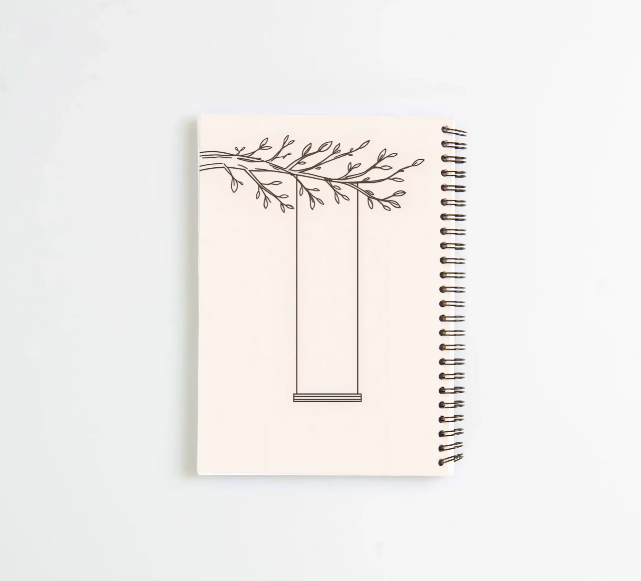 Empty swing hanging from a tree branch in a minimalist art spiral notebook by DesignDoodle