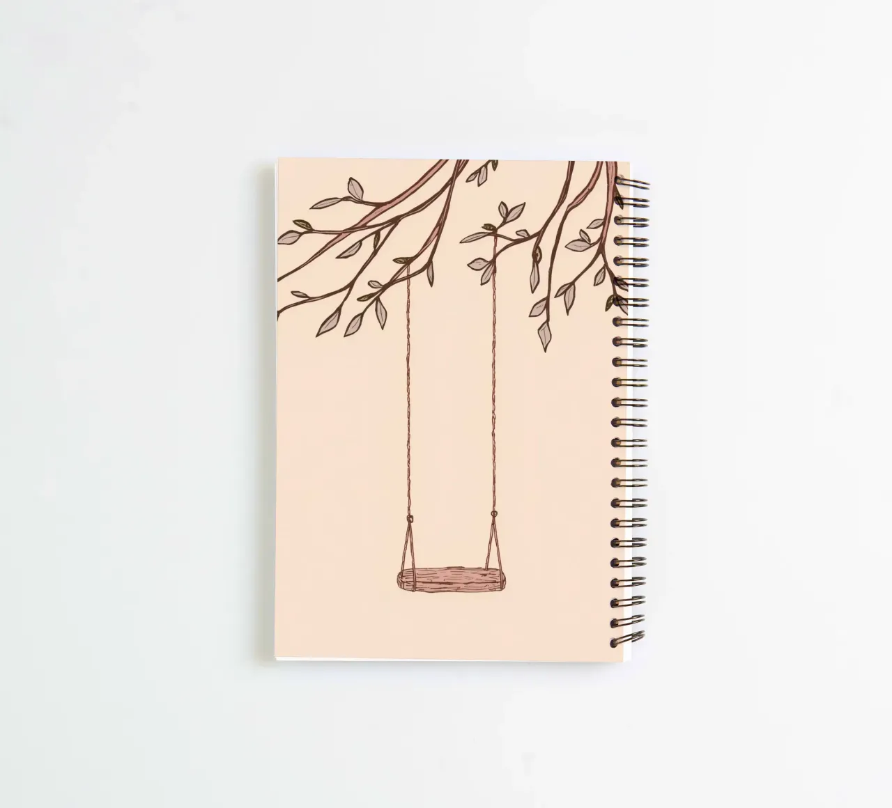 Swing hanging from a tree branch with delicate leaves spiral notebook by DesignDoodle