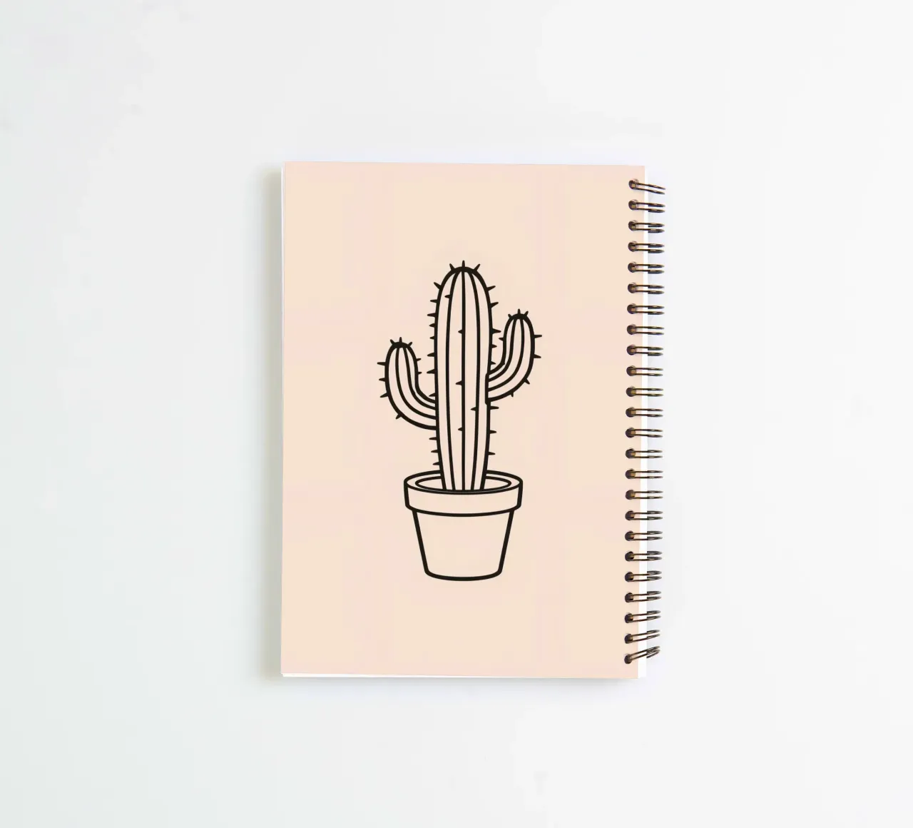 Cactus in a simple pot displayed against a plain background spiral notebook by DesignDoodle