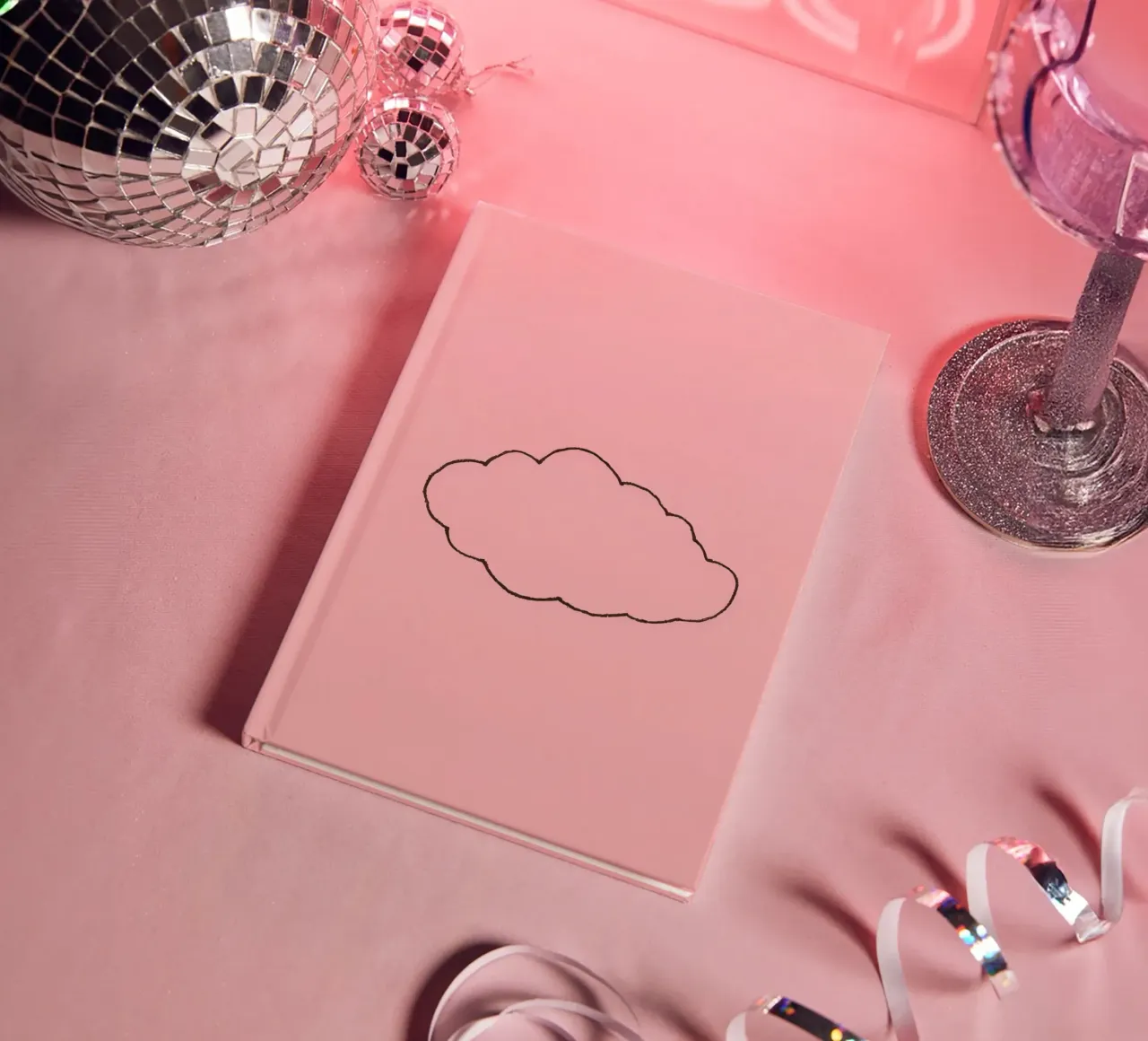 simplistic cloud design on a soft pink art notebook by DesignDoodle