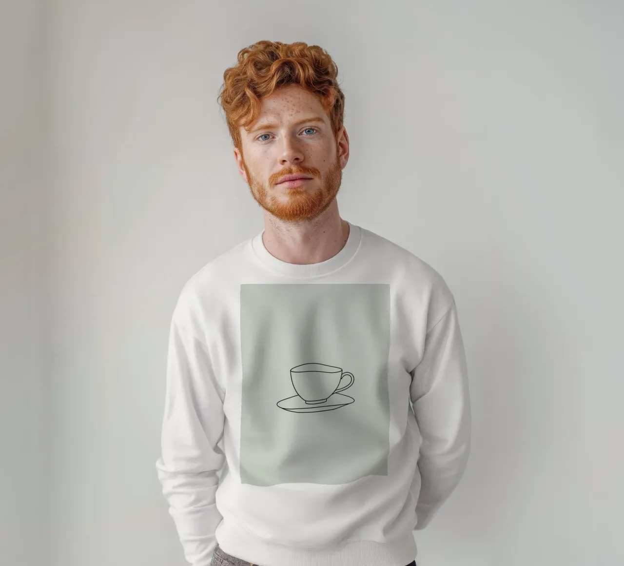 Semplice schizzo di una tazza da tè su un piattino esposto su un minimo felpa da DesignDoodle