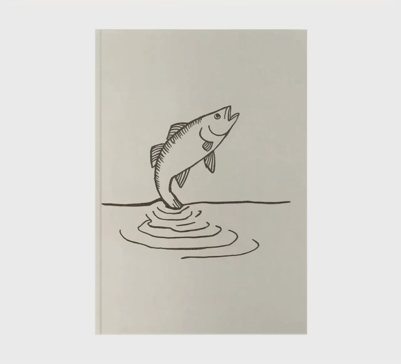 Fish leaping above the water in a natural setting showcasing notebook by DesignDoodle