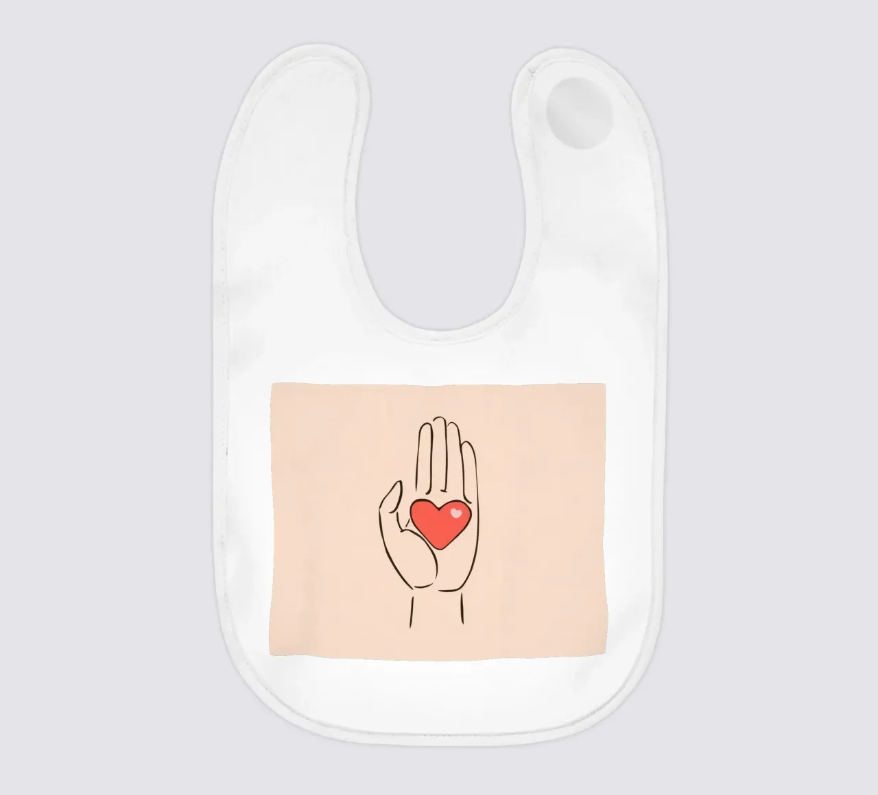 Mano che regge un cuore che rappresenta amore e gentilezza bavaglino da DesignDoodle