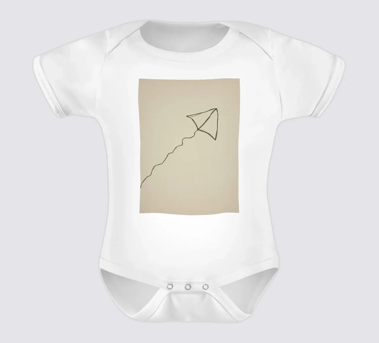 Kite soaring with a flowing tail attached, showcasing joyful short-sleeve baby romper by DesignDoodle