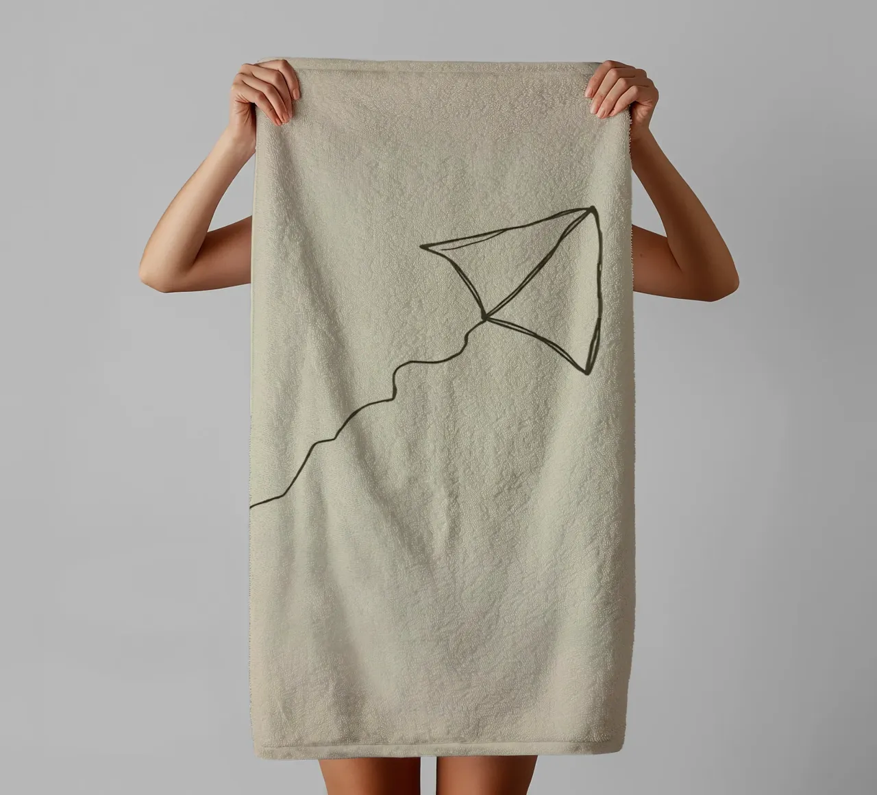 Kite soaring with a flowing tail attached, showcasing joyful towel by DesignDoodle