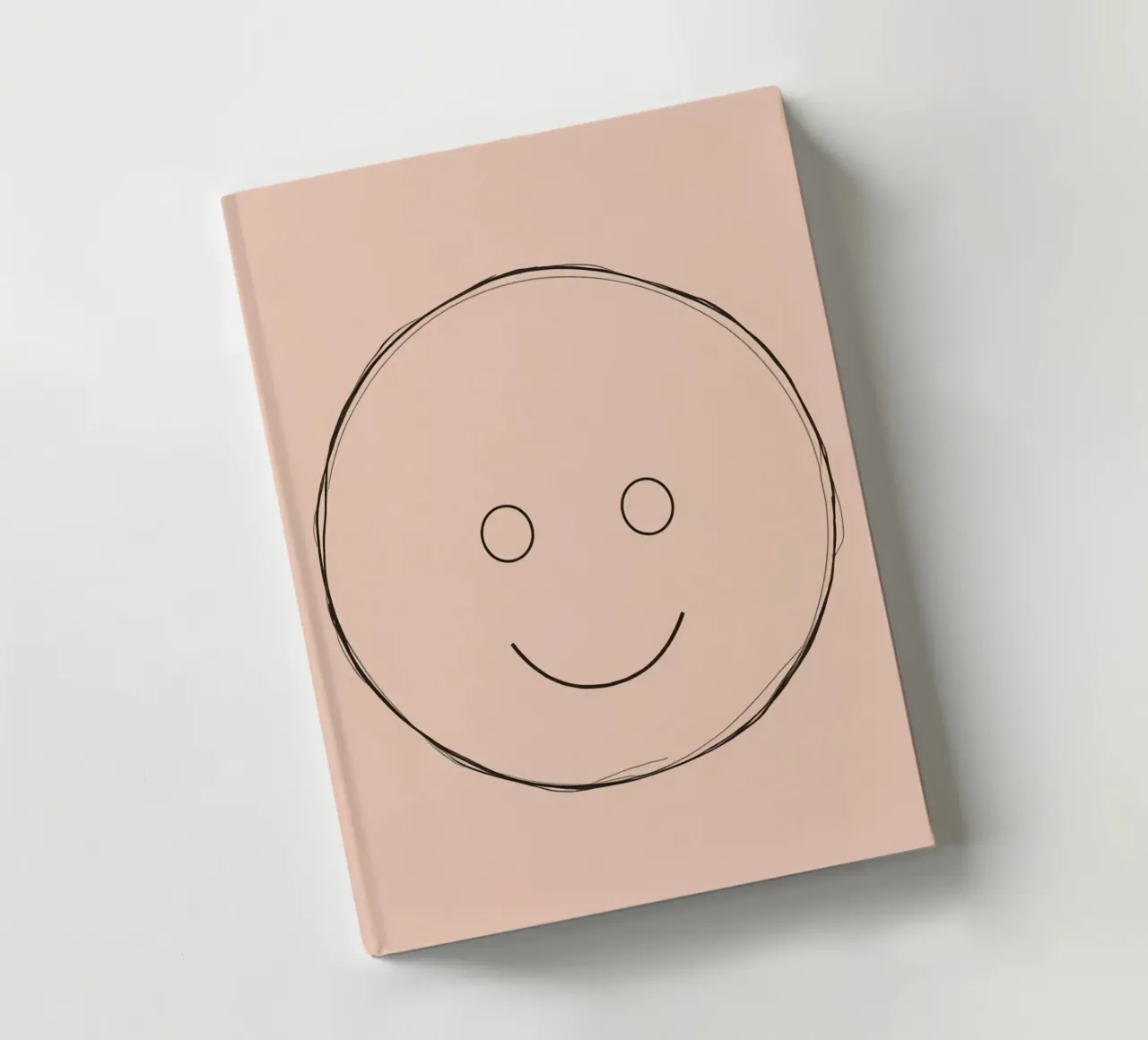 Simple smiley face illustration on a plain peach background notebook by DesignDoodle