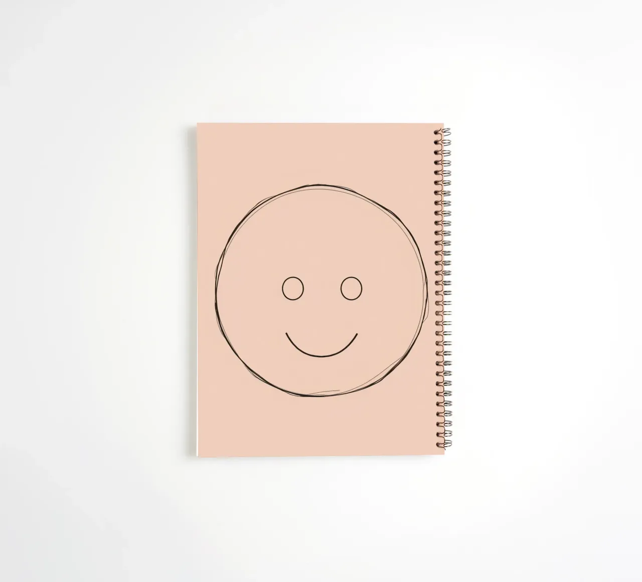 Simple smiley face illustration on a plain peach background spiral notebook by DesignDoodle