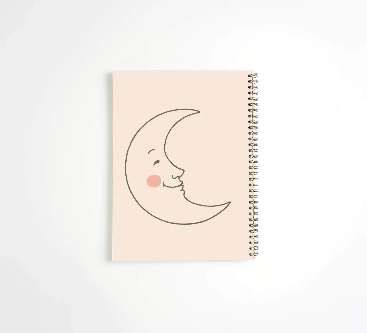 Happy moon illustration with a smiling face on a light art spiral notebook by DesignDoodle