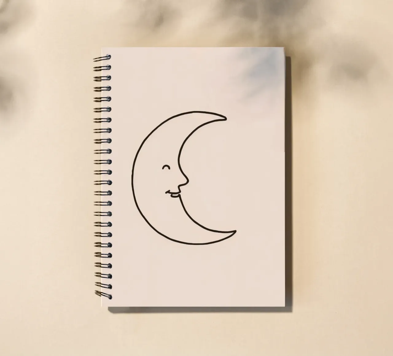 Crescent moon with a smiling face on a soft background spiral notebook by DesignDoodle