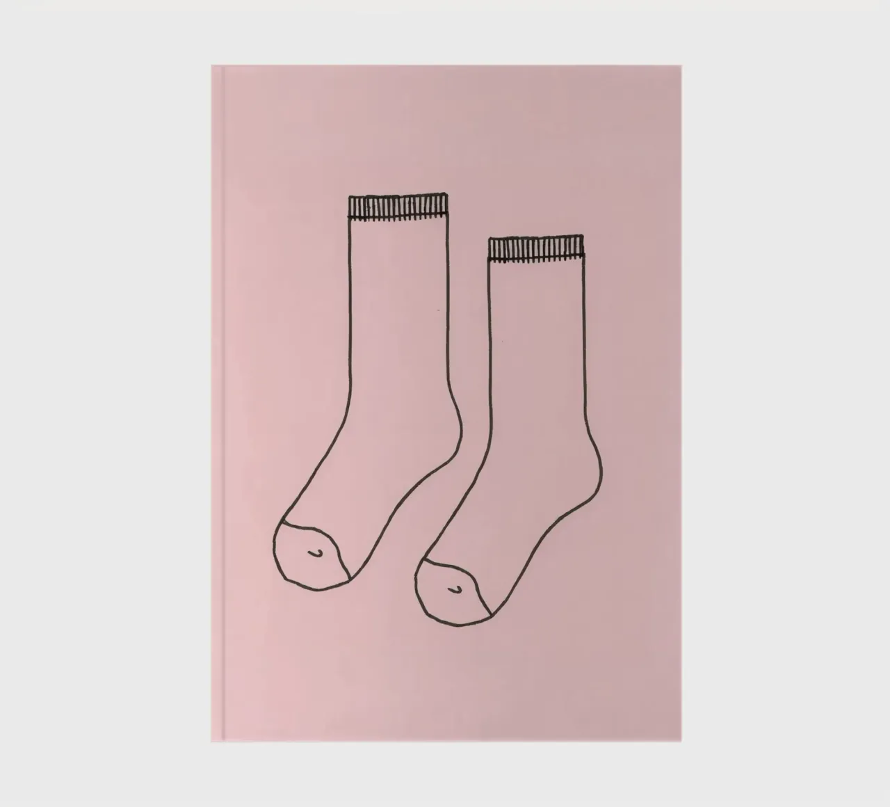 Simple design of a pair of socks with a pink background notebook by DesignDoodle