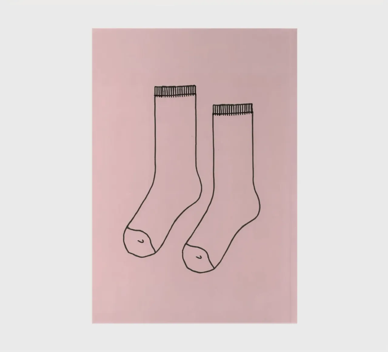 Simple design of a pair of socks with a pink background notebook by DesignDoodle