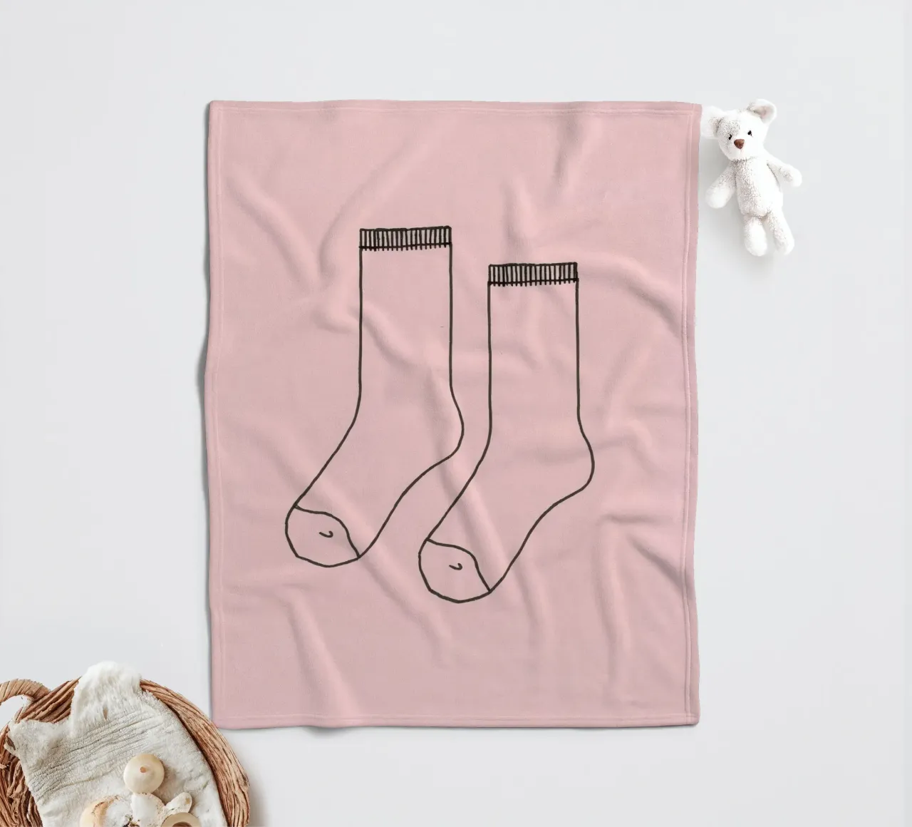 Simple design of a pair of socks with a pink background fleece blanket by DesignDoodle