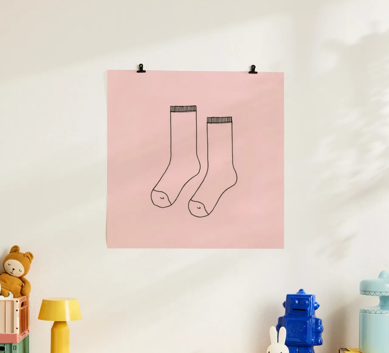 Simple design of a pair of socks with a pink background hahnemühle by DesignDoodle