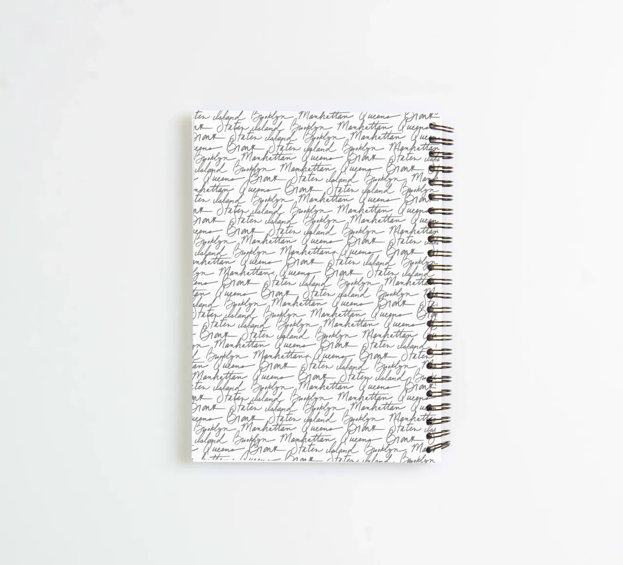 NYC Boroughs Script: White Manhattan, Brooklyn Pattern spiral notebook by ClubArt