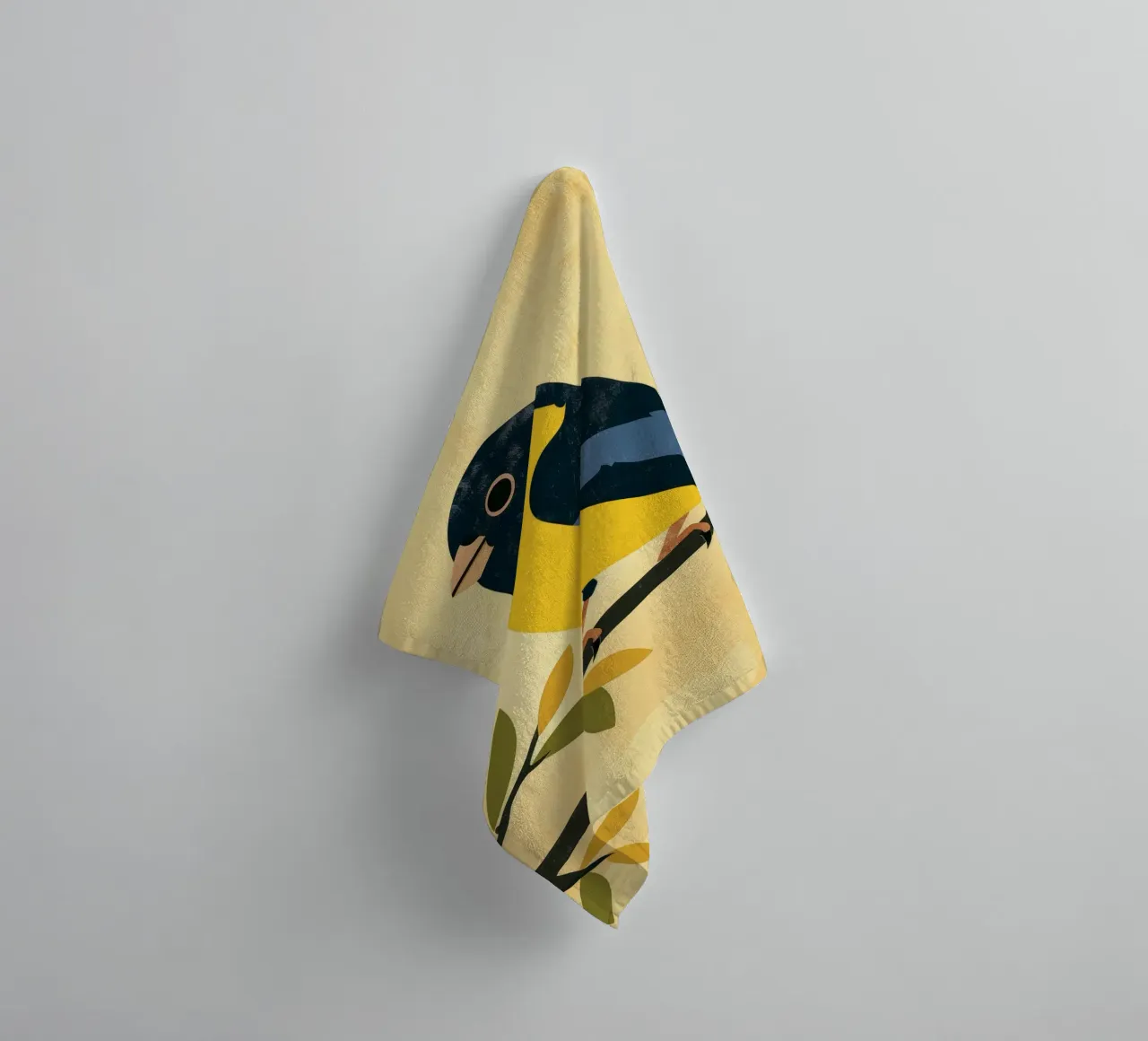 Yellow and blue bird perched on branch with leaves towel by DesignDoodle