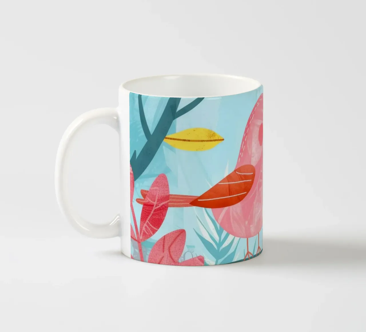 Uccello rosa appollaiato su un ramo circondato da piante frondose tazza in ceramica da DesignDoodle