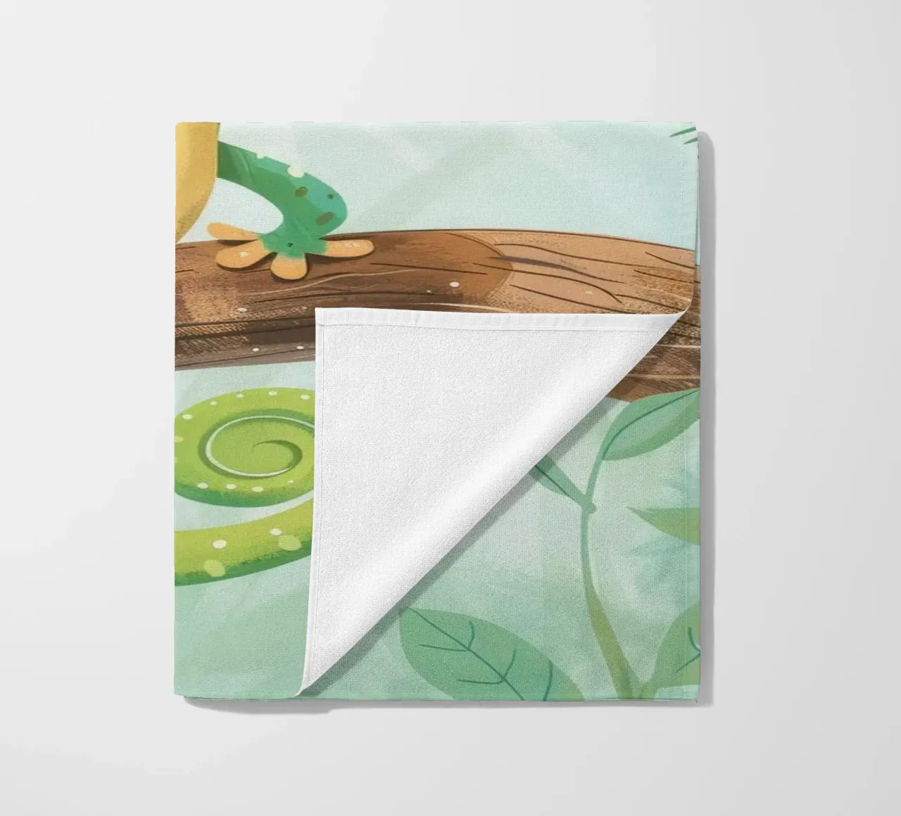 Cheerful green lizard resting on a branch amid leafy beach towel by DesignDoodle