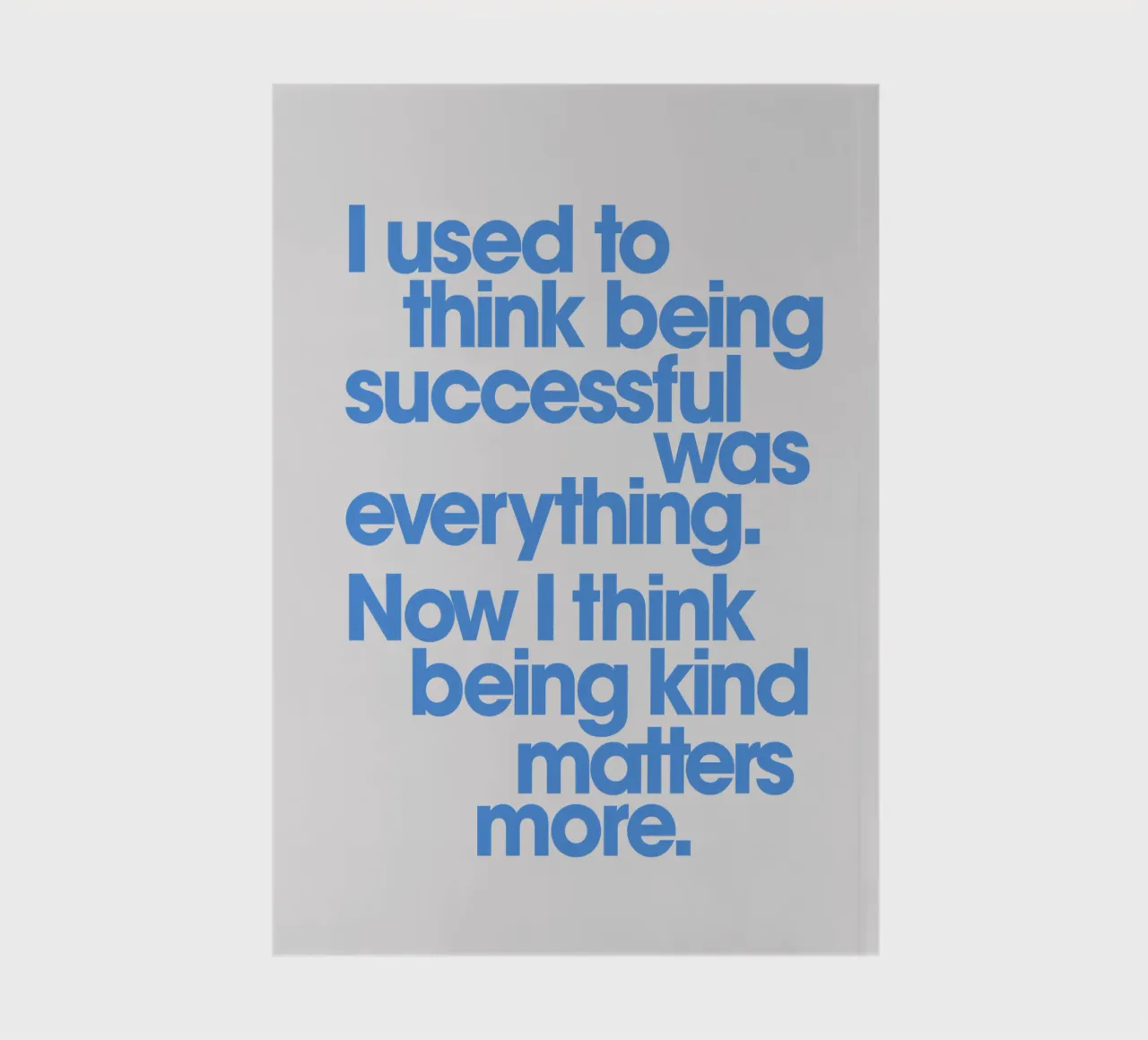 Being Kind Matters More Typography Quote Print in Blue notebook by THE MOTIVATED TYPE