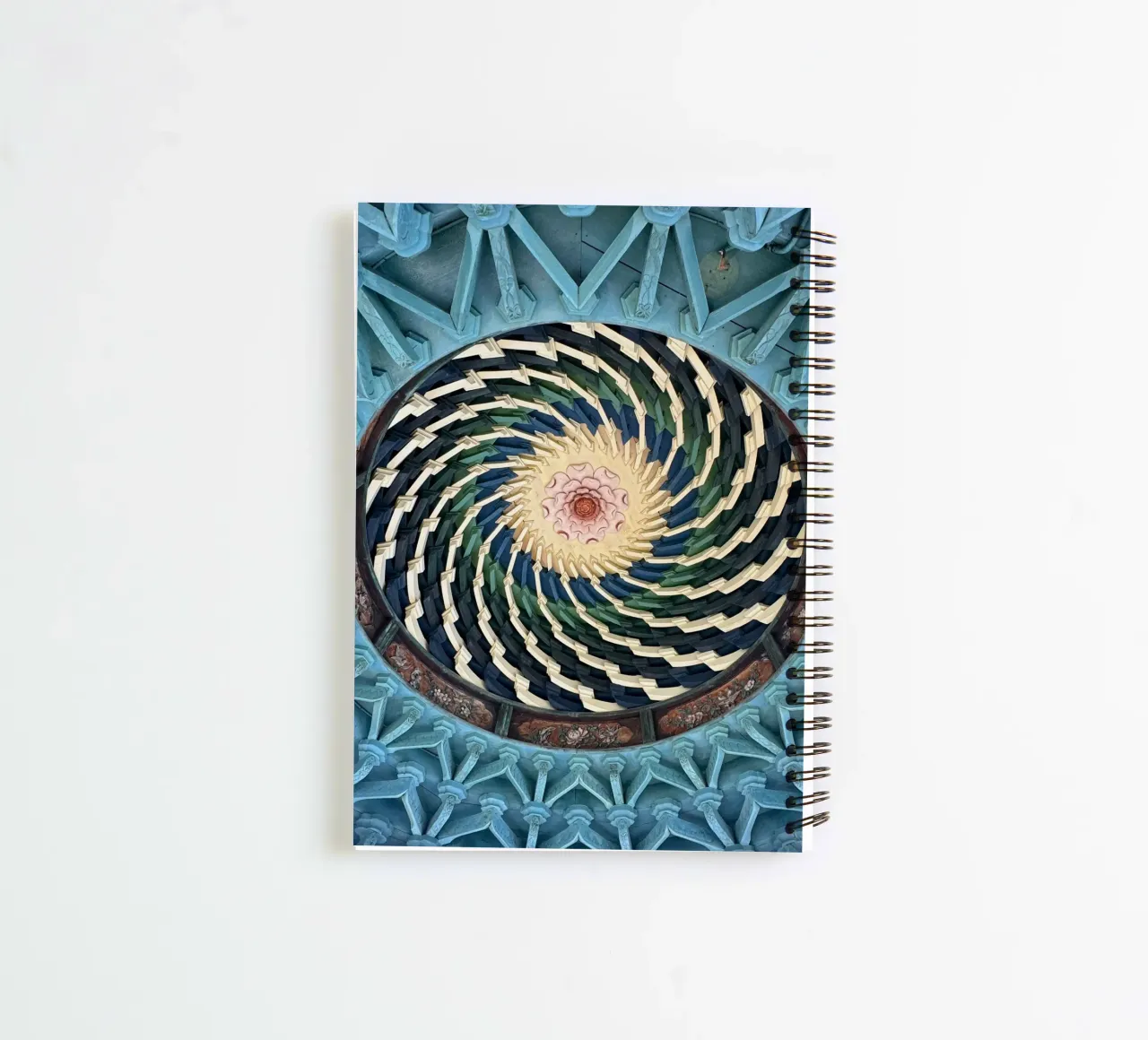 Vibrant spiral pattern on ceiling of a Japanese temple spiral notebook by byrieneke