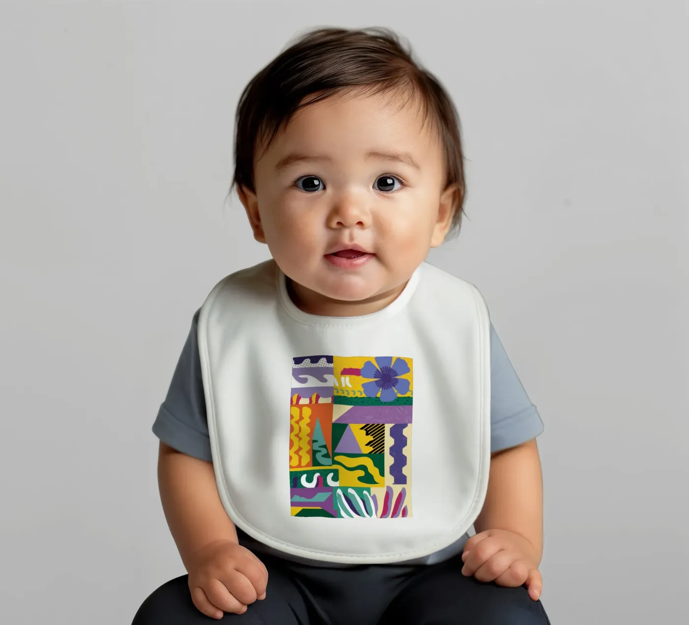 Patchwork Pattern Play baby bib by Monuments Fire