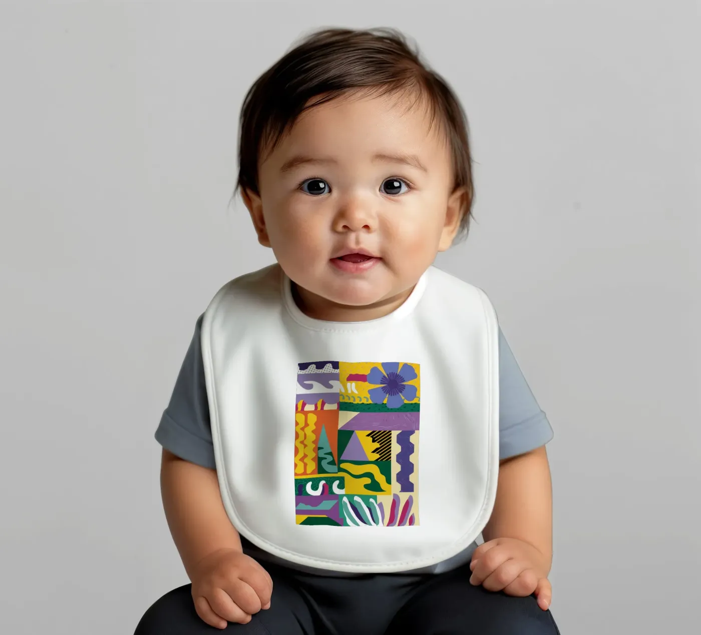 Patchwork Pattern Play baby bib by Monuments Fire